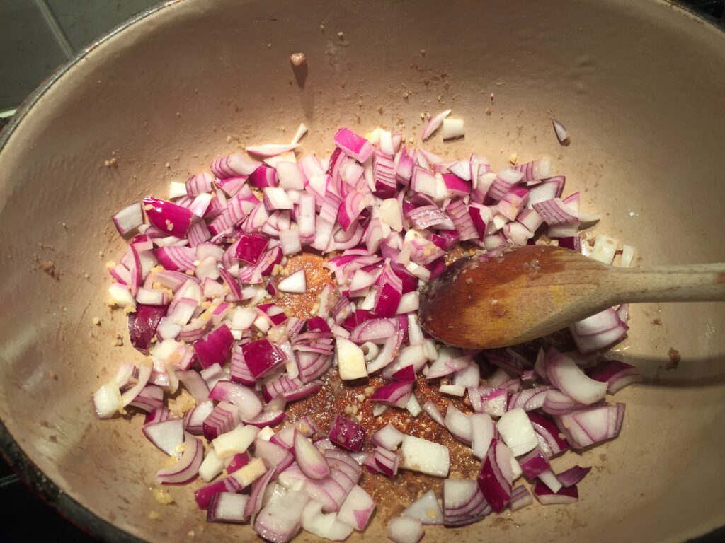 Adding onions and garlic
