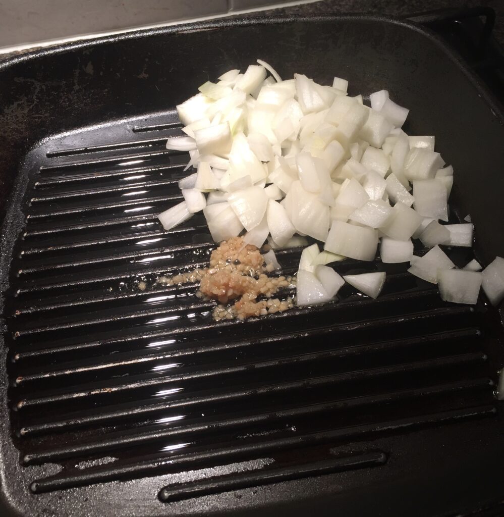 Adding the onion and garlic