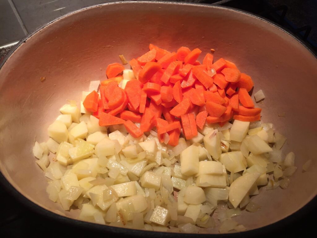 Add the potatoes and carrots