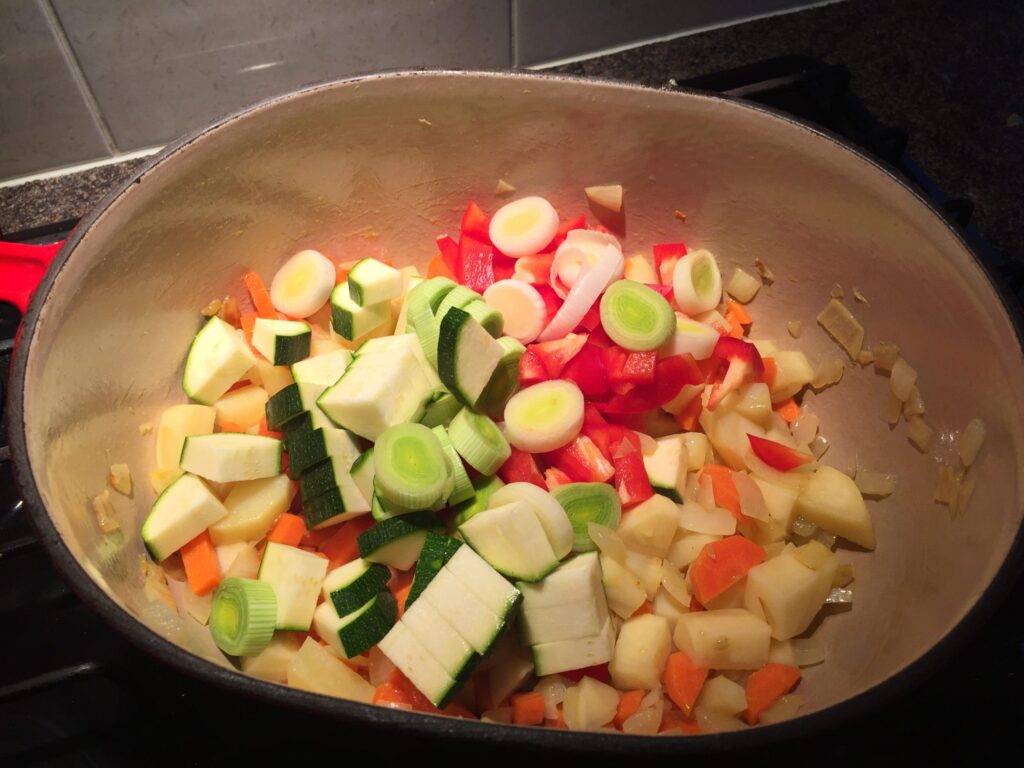 Adding the pepper, leek and courgette