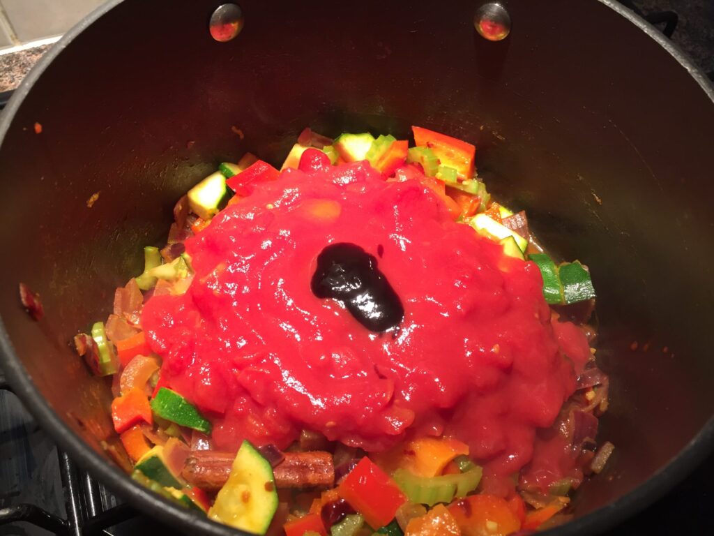 Add the tomatoes and tamarind