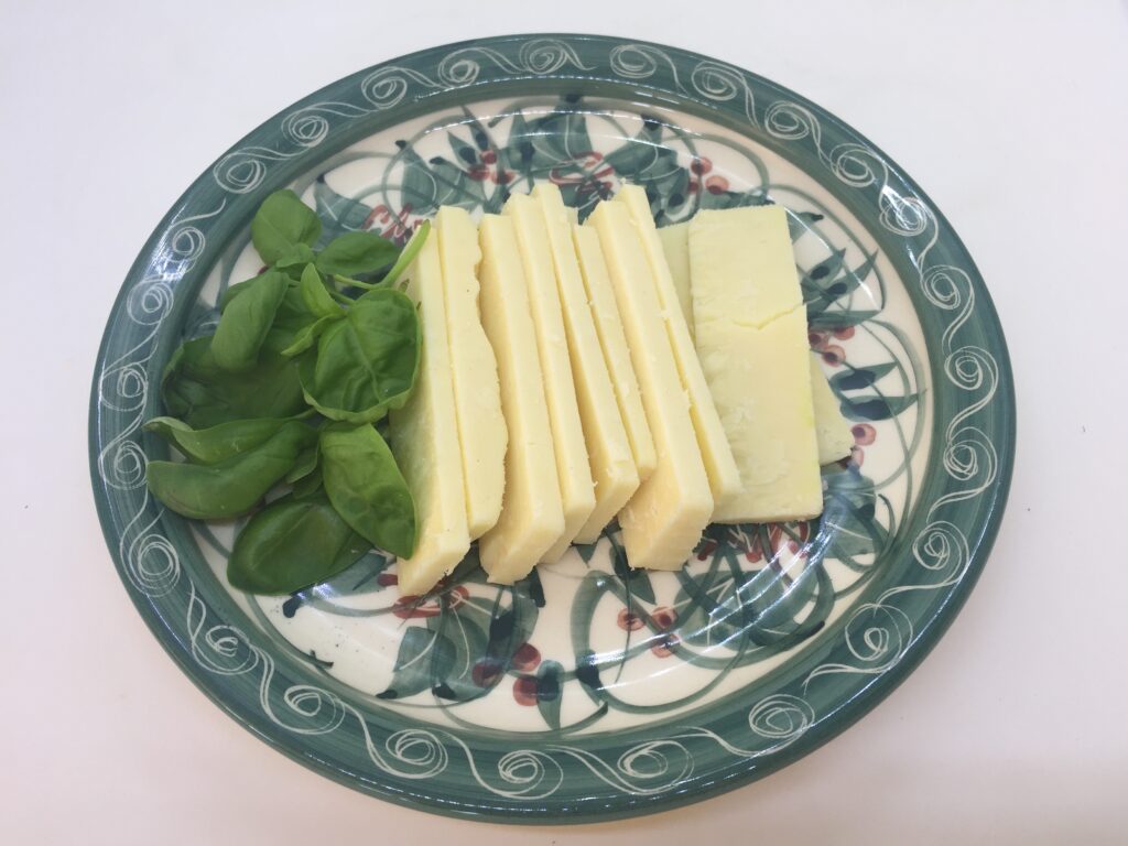 Sliced cheese and basil